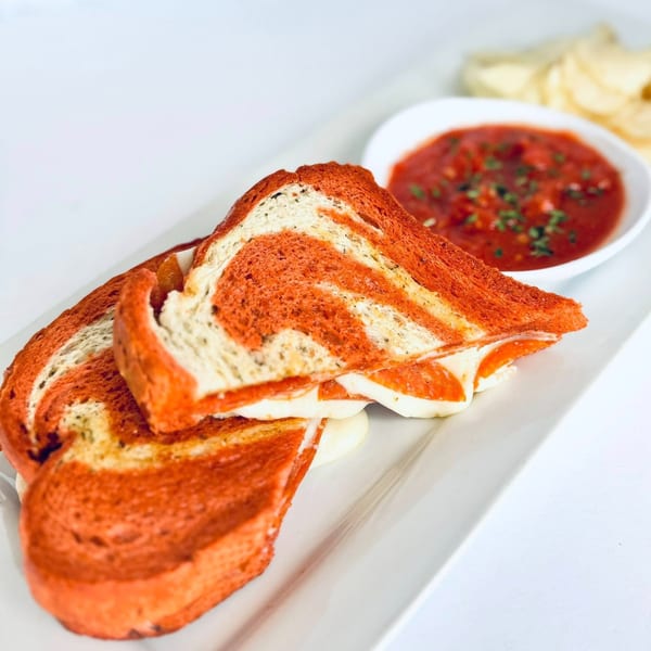 Ma Ma Fia's East's grilled cheese with red and white swirled bread, served with marinara sauce.
